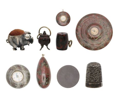 A selection of objets d'art including Cornish red serpentine. To include two silver hallmarked thimbles, a modern silver pig 
