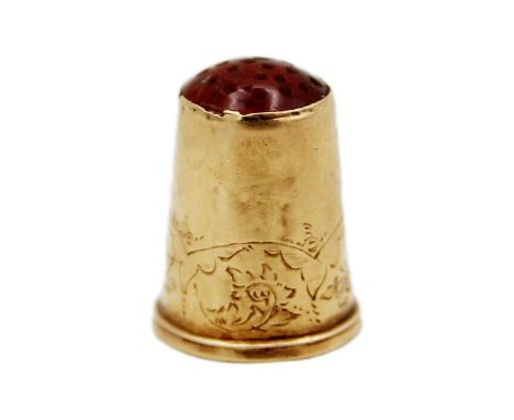 A Swedish 18k thimble with a carnelian set top. The sides with foliate scroll band, stamped with makers mark WL, national con