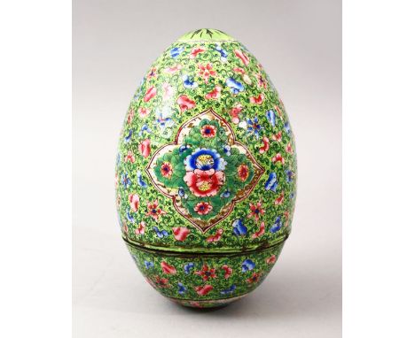 A GOOD 19TH CENTURY CHINESE CANTON ENAMEL EGG, the egg with a green ground  with floral panel decoration, further decorated w
