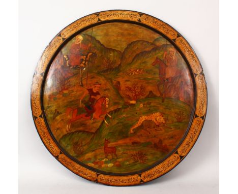 A GOOD 19TH CENTURY PERSIAN PAPIER MACHE PAINTED ROUND PANEL, with calligraphy reading " ali mohammad" the panel depicting hu