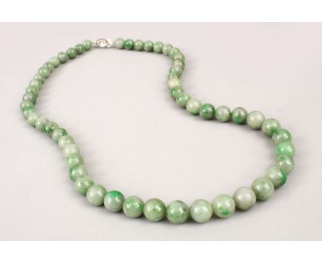 A GOOD CHINESE APPLE GREEN CARVED JADE NECKLACE, approx 52cm.