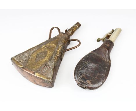 A GOOD 19TH CENTURY PERSIAN ENGRAVED BRASS AND COPPER POWDER FLASK and another leather powder flask with metal measuring spou