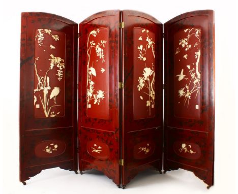 A GOOD JAPANESE MEIJI PERIOD CARVED IVORY AND LACQUER FOUR FOLD SCREEN, The red lacquer with native floral decoration, each s