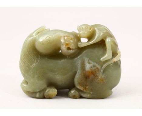 A GOOD 19TH CENTURY CHINESE CARVED JADE FIGURE OF A SEATED HORSE, the horse with a monkey climing upon its back, 5.5cm high x