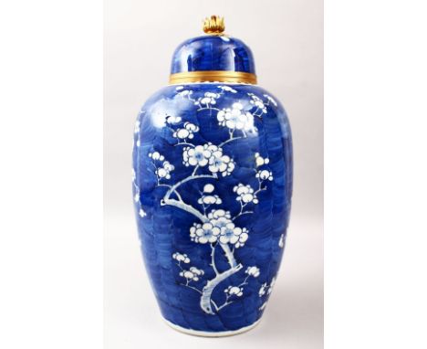 A 19TH CENTURY CHINESE BLUE &amp; WHITE ORMOLU MOUNTED PRUNUS JAR &amp; COVER, the vase with a drilled base and cover to hous