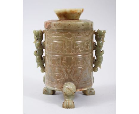 A GOOD CHINESE CARVED JADE JAR AND COVER, with carved decoration of geometric style, with twin chilong handles and lion dog h