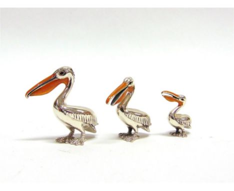 A GRADUATED SET OF THREE SATURNO SILVER AND ENAMEL PELICANS,  the largest approx 4cm high