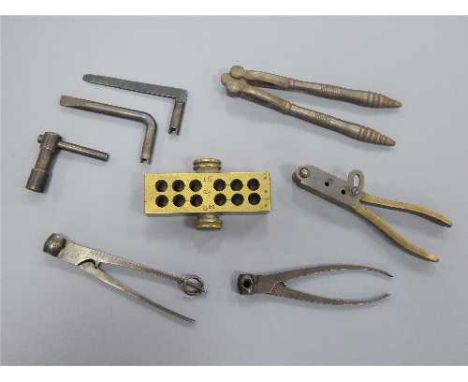 A 19th century brass grain measure stamped 'Maw London', together with a small quantity of bullet moulds, nutcracker, tools e
