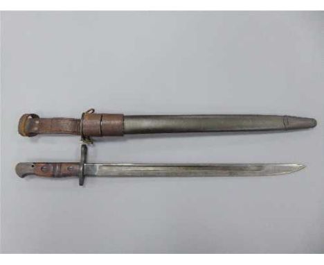 A WWI American Remington bayonet, the 43cm blade stamped 1917 and US below a flaming grenade, in leather scabbard with leathe