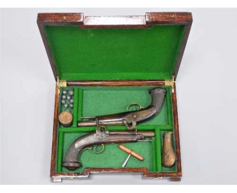 A pair of early 19th century percussion cap pistols, the 15cm barrels octagonal at the breach, with steel ramrods, brass trig