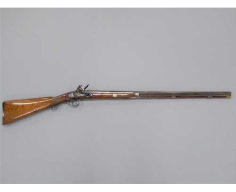 A late 18th/early 19th century flintlock fowling piece by Bellis, the 78cm damascus barrel octagonal at the breach, with burr