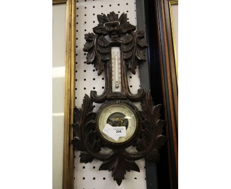 Wooden framed thermometer and weather gauge