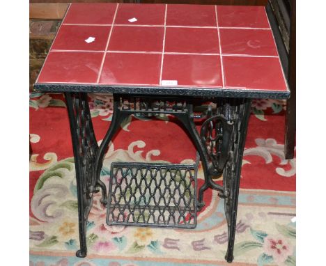 A Singer treadle sewing machine base converted to a tile top table.