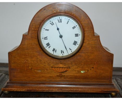 An Edwardian mahogany inlaid mantel clock