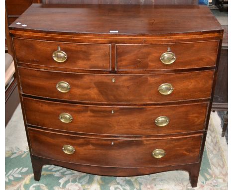 An early 19th century bow front mahogany chest, caddy top, two short cockbeaded drawers over three graduated long, 102cm high