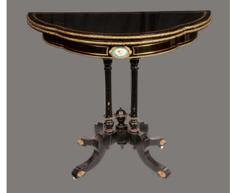 A 19th century porcelain and gilt metal mounted shaped demi-lune card table, folding top enclosing an inset baize playing sur