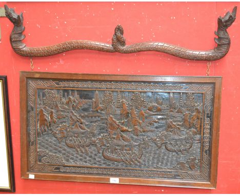 A Chinese hardwood rectangular panel, carved in relief with a monumental busy riverscape of three dragon boats, archipelagoes