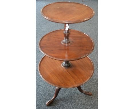 A George III mahogany three-tier dumbwaiter, graduated dished circular plateaux, turned pillar, cabriole legs, pad feet, 111c