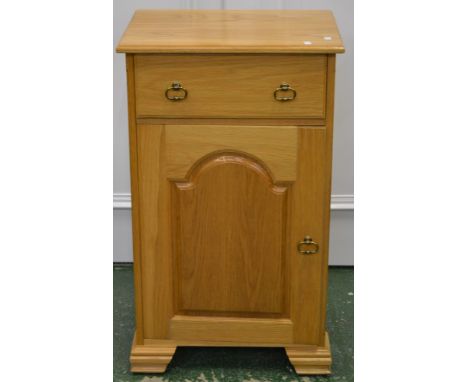 A modern light oak side cabinet, single drawer over fielded panel door cupboard. 92cm high x 55cm wide x 42.5cm deep.