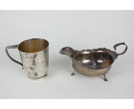 A George V silver christening mug with engraved initials, maker William Hutton, Sheffield 1927, and a George V silver sauce b