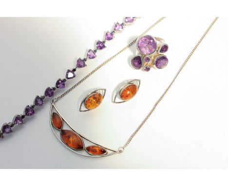 A silver and amber necklace and matching ear studs, and a gem set silver bracelet and dress ring