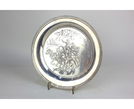 A modern silver circular dish with engraving of a horse drawn troika, signed Cuneo, maker Roberts and Dove, London 1972, 7oz,