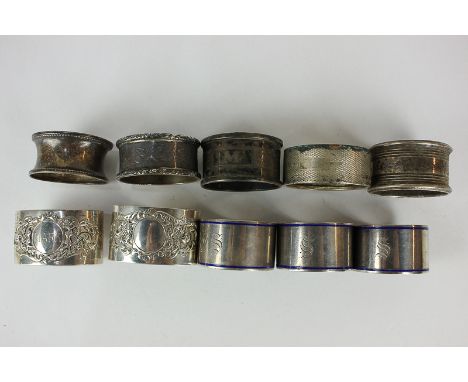 A set of three George V silver and blue enamel napkin rings, maker Robert Pringle & Sons, Chester, 1918, together with a pair