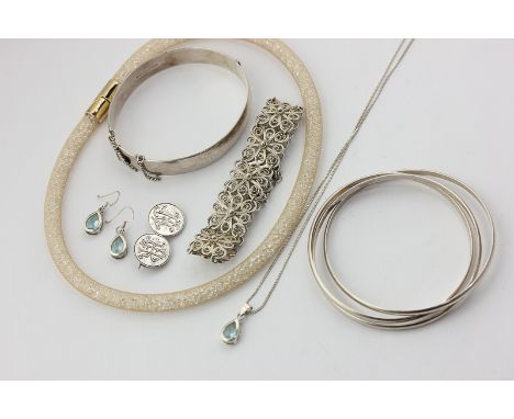 Two silver bangles, filigree bracelet, coin brooch, topaz drop earrings and matching pendant, a Swarovski crystal collar 