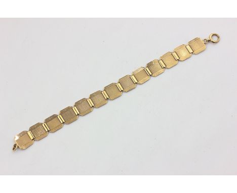 A 9ct gold bracelet with engine turned panels, 13.8g