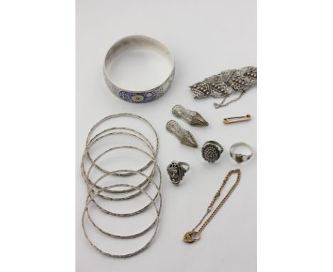 A silver and enamel bangle, six silver bangles, and various silver items 