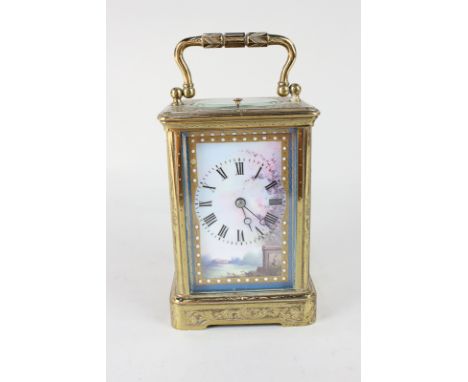 A French gilt metal and porcelain repeater carriage clock with decorative landscape porcelain dial, the side plaques with lad
