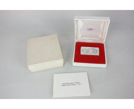 A 1974 silver Christmas ingot by Franklin Mint, 'The Snowman' limited edition, marked Sterling, in original box with leaflet