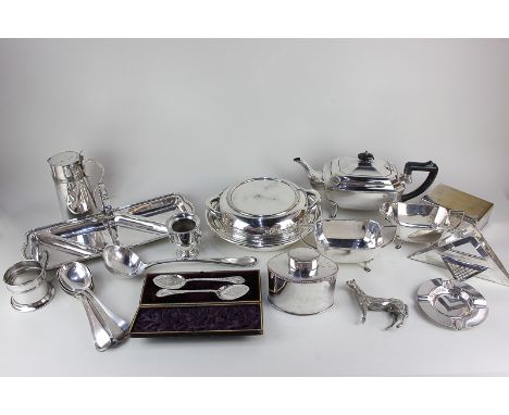 A large collection of silver plated tableware, including a circular entree dish with three divisions, a rectangular serving d