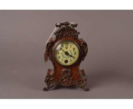 A belle époque miniature French mantel clock, of rococo form, with floral festoons to the dial, and marked Lenzkirch 128558 t
