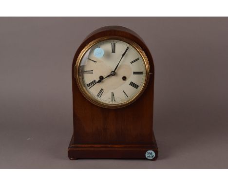 A mahogany mantel clock, of arched form, striking on coiled rod AF 