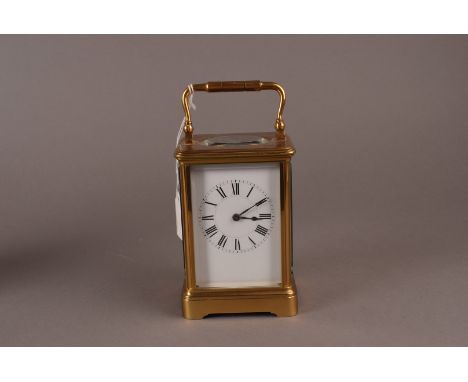 A good brass cornice cased French carriage clock, with Roman dial c.1890, the eight day striking works marked with a parrot a