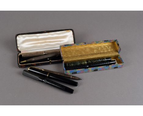 Five vintage fountain pens and two pencils, including a silver fountain pen and pencil set, boxed, a black Swan, a black Summ