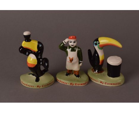 Three Carltonware Guinness porcelain figures, including a man in appron and two toucan figures (3) 