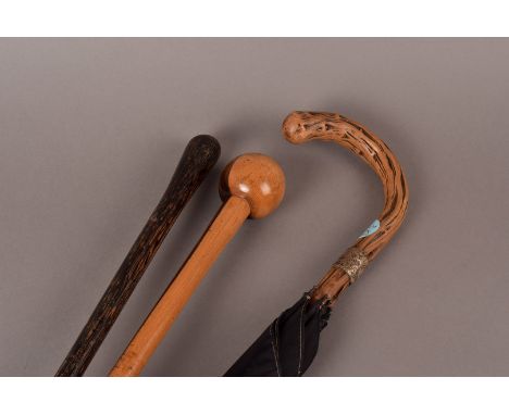 A Ball top walking stick, of turned construction made with twin coloured heart wood, another hardwood walking sick  together 