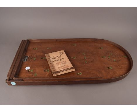 A Corinthian "Olympian" Bagatelle, stained beech wooden construction, complete with steel balls and game book. 