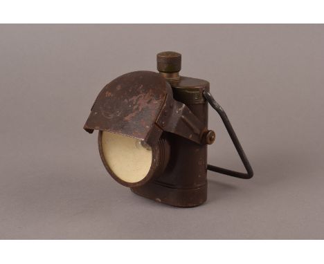 A World War II Bicycle Black Out Lamp, marked to clip Electric Number 1, 