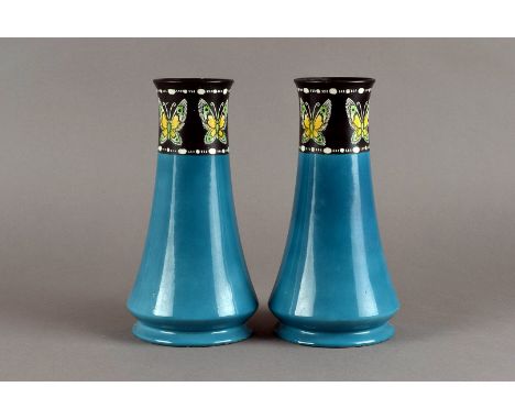 A pair of Shelley ceramic vases, the dark aqua ground lower section leading to a slendered black ground top with butterfly de