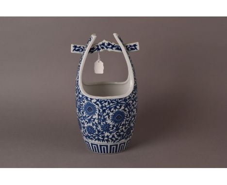 A Chinese Pale Vase, with blue and white stylised chrysanthemum intertwined design and pierced pagoda stretcher handle trough