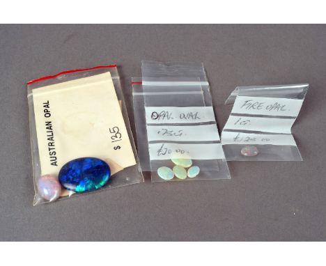 A small selection of opals,  including an black opal doublet and other white examples (a parcel) 