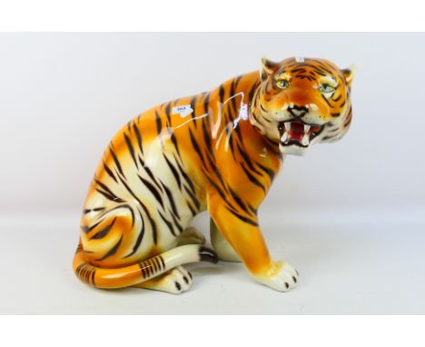 A large ceramic study of a tiger, approximately 45 cm (h)