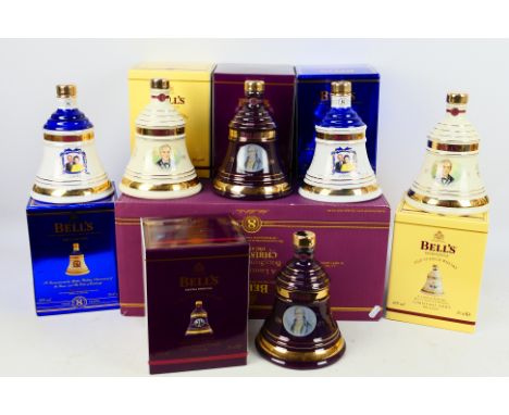 Six 70cl bottles of Bells 8 Year Old Scotch Whisky, all 40% abv, comprising four Christmas decanters (two 2002 and two 2003) 