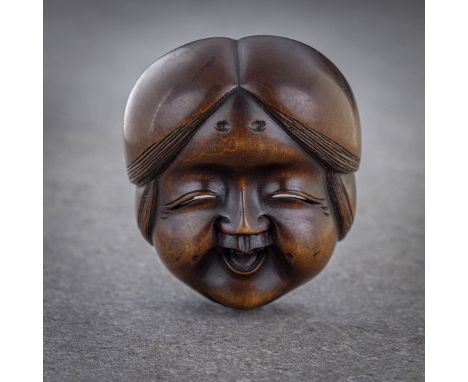 A WOOD SHUNGA MASK NETSUKE OF OKAME Signed, possibly Ryusai, Japan, Edo (Tokyo), mid-19th century, Edo period (1615-1868) or 