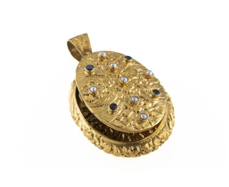 An 18ct yellow gold sapphire and seed pearl oval locket the hinged cover mounted with seven seed pearls and four sapphires in