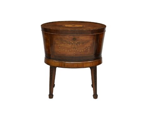 A Regency oval inlaid mahogany and marquetry wine cooler the oval crossbanded top with central fan patera and husk inlay to t