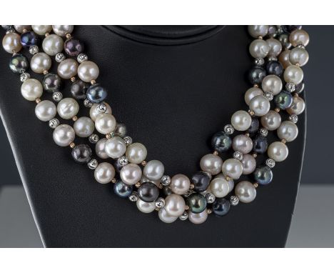 A black and white pearl silver necklace the approx 9mm white pearls with pink, cream and silver lustre, with black pearls of 
